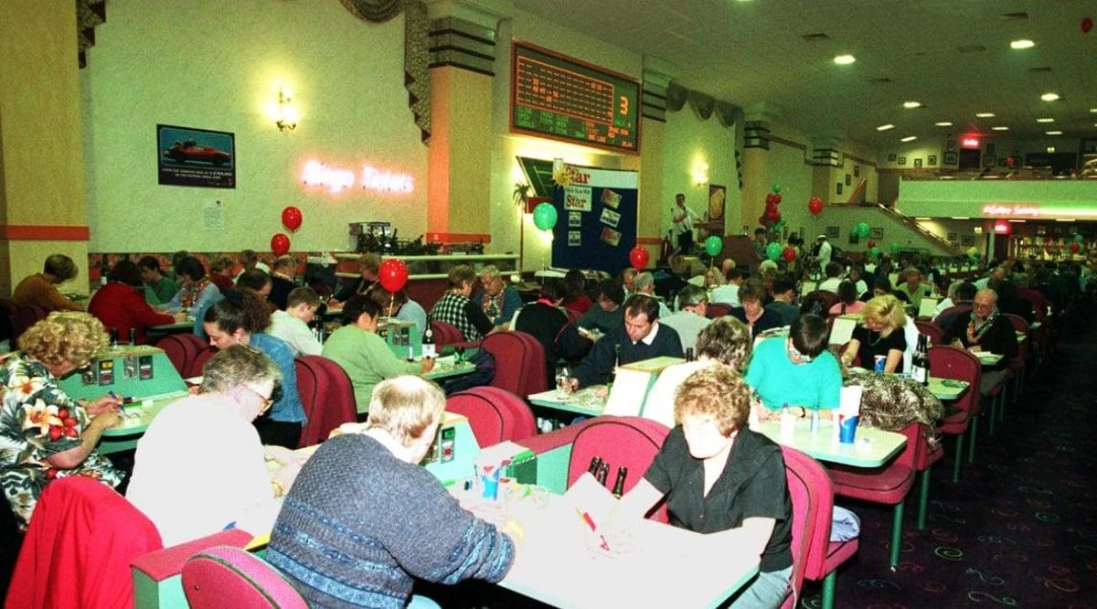 A crowded bingo hall at play