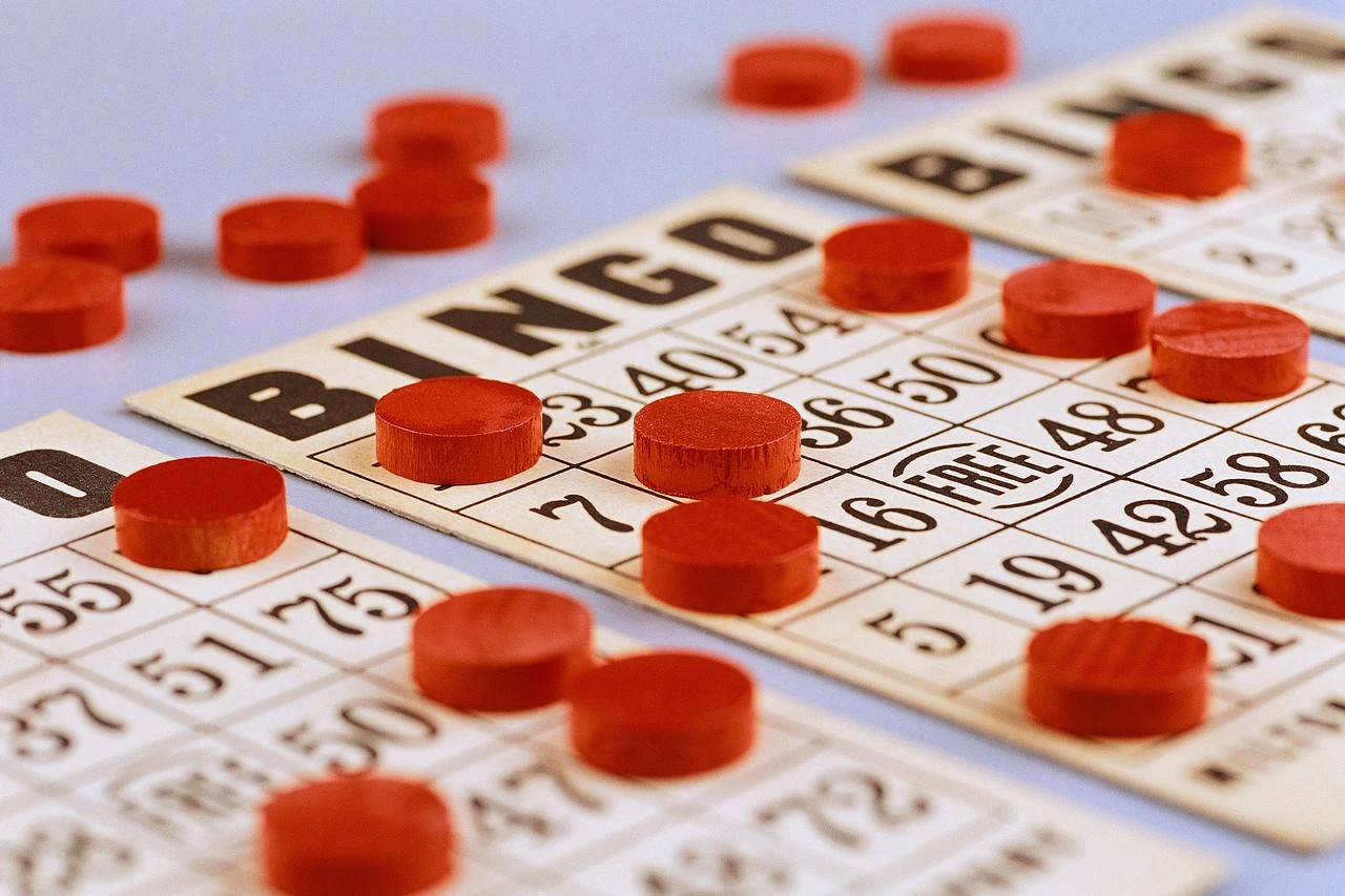Red bingo chips on numbered cards