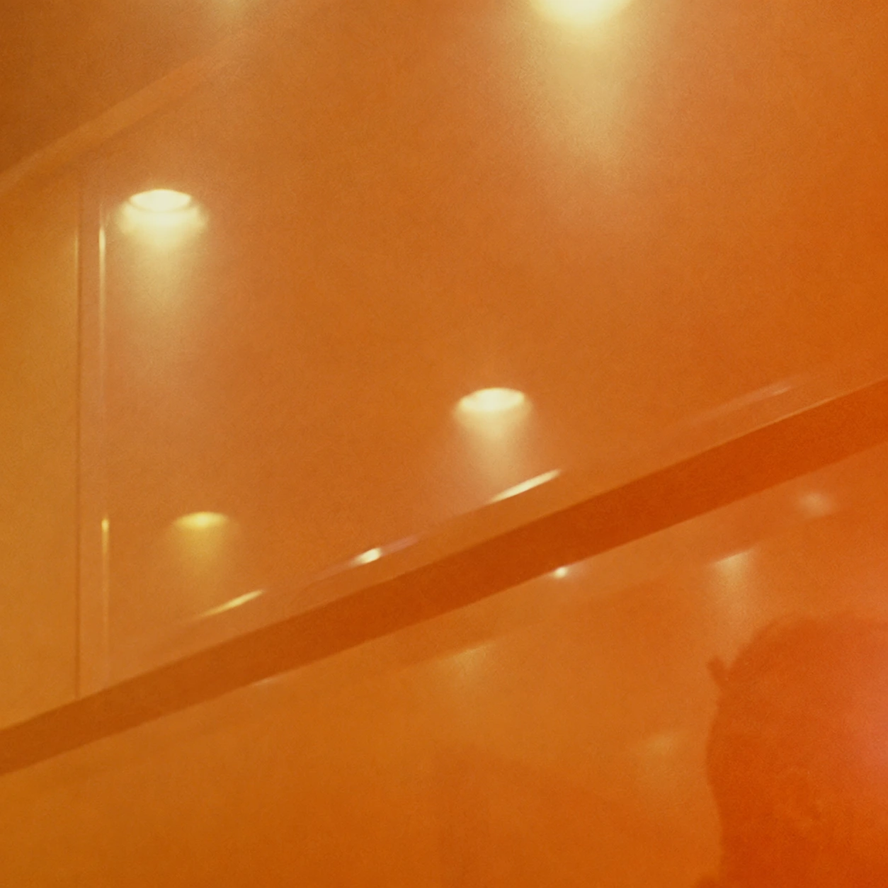 Amber haze, ceiling lights and handrail isolated from the supplied cinematic reference