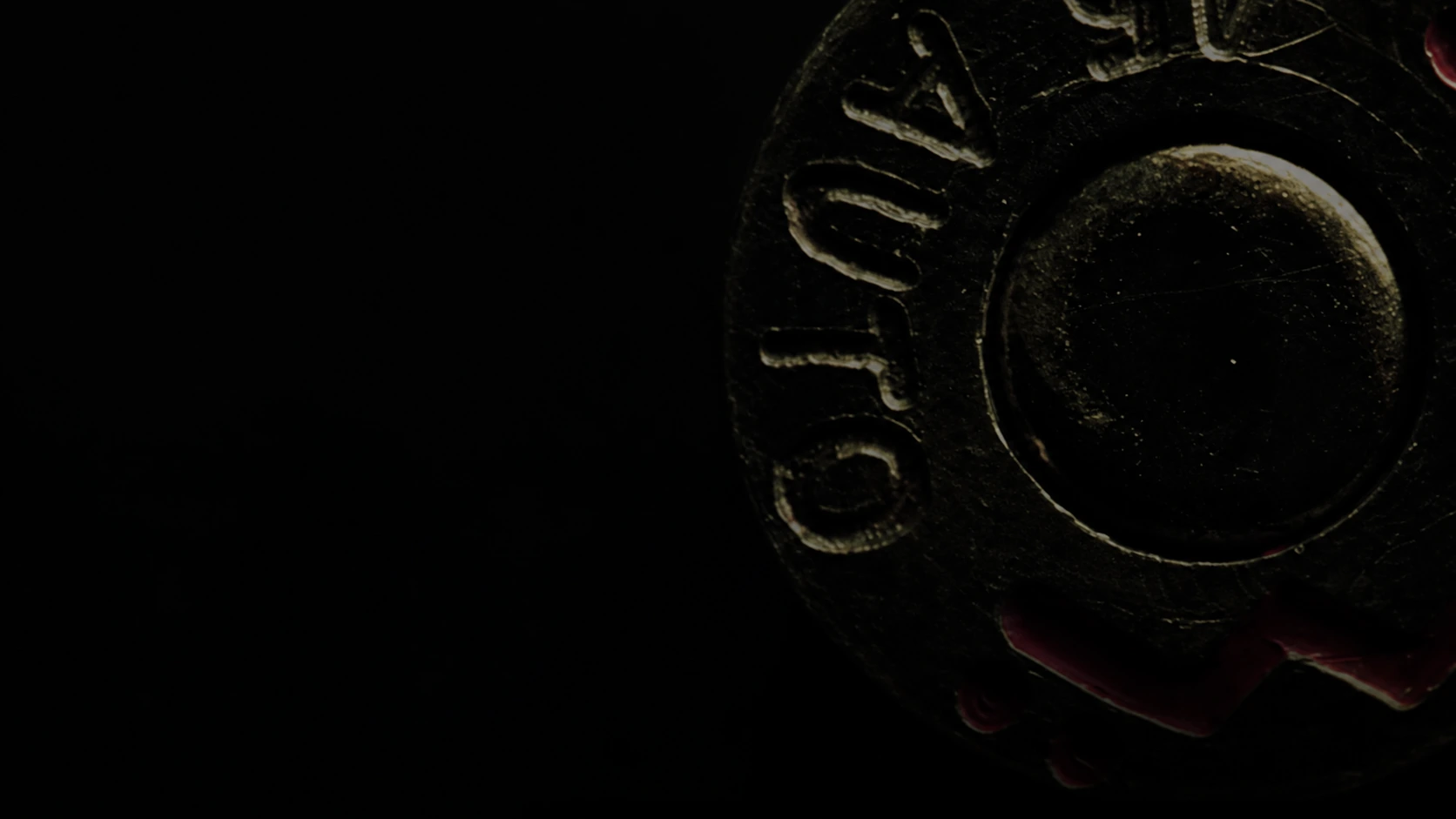 Cartridge-base detail isolated from the cast-reference background