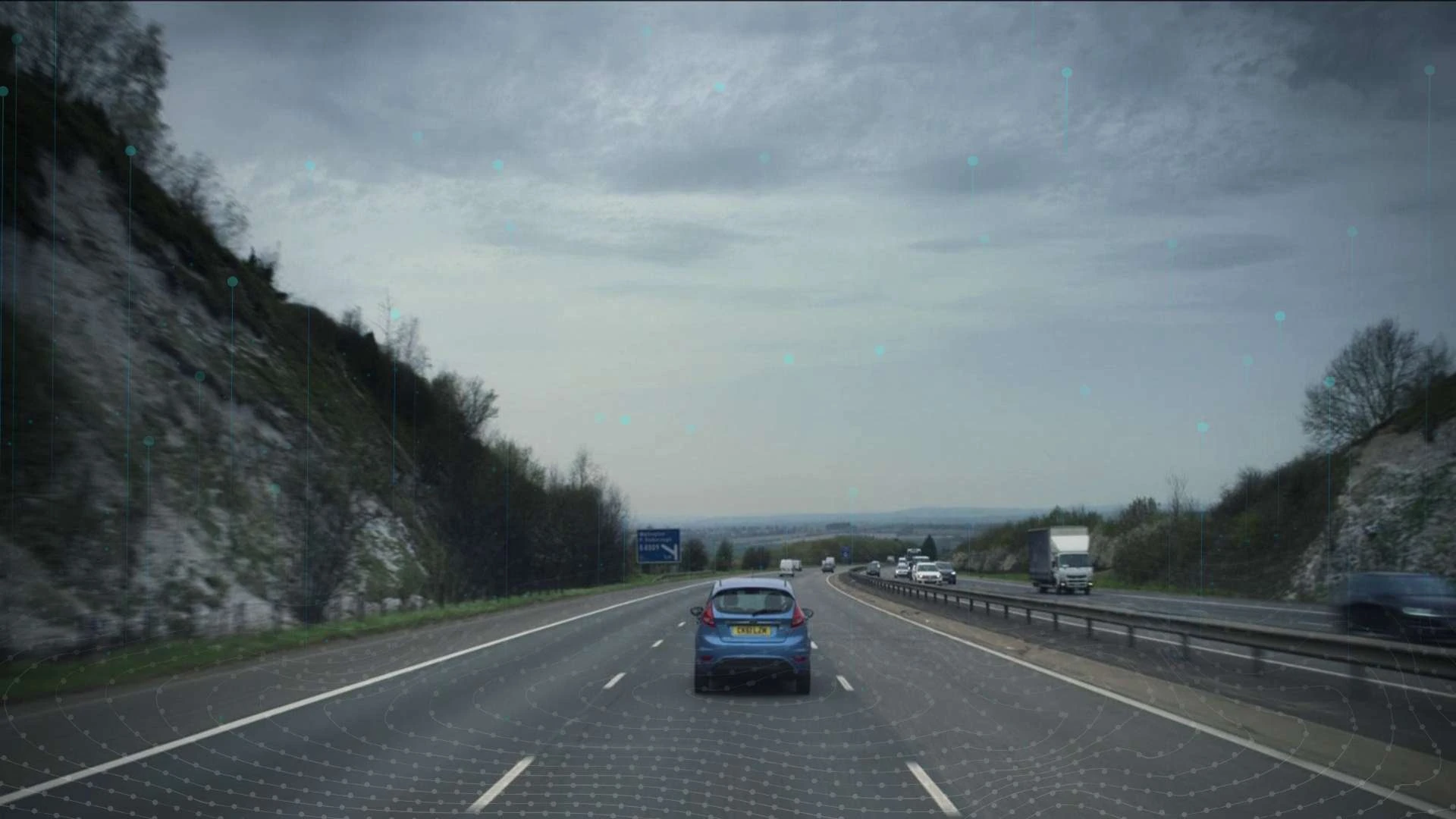 Highway and overcast landscape with the deck’s augmented-reality overlay